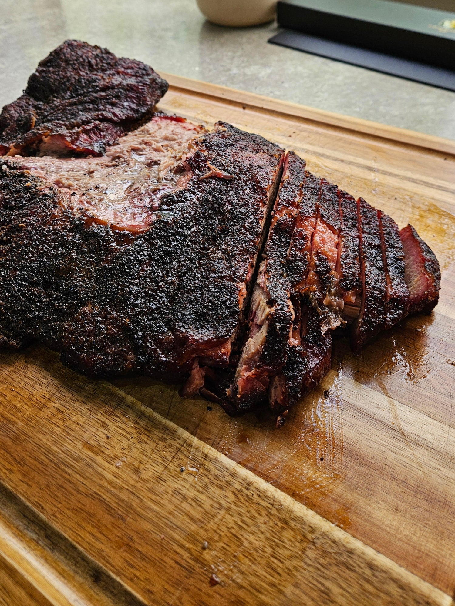 smoked brisket on a cutting board