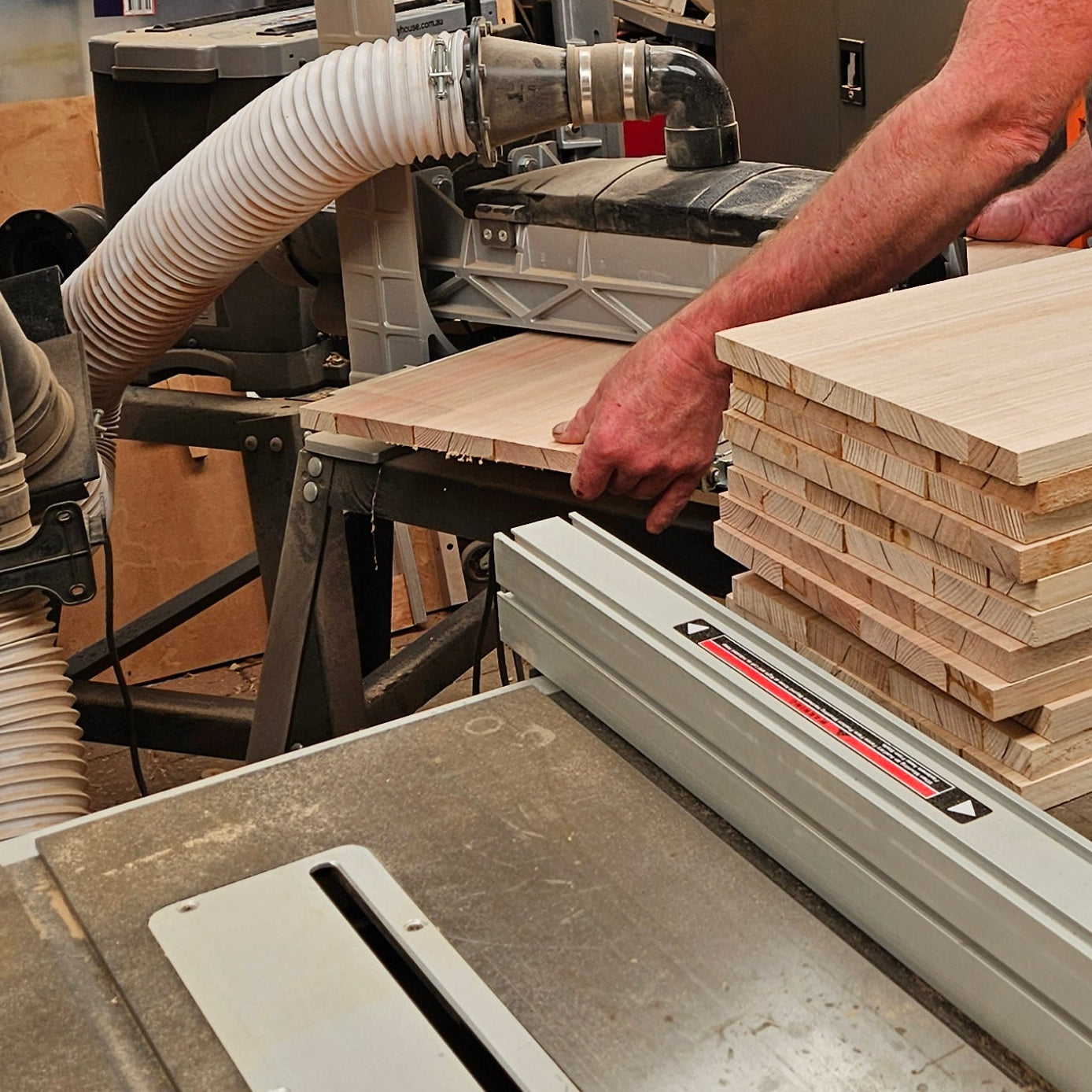 Person working with wood in a workshop