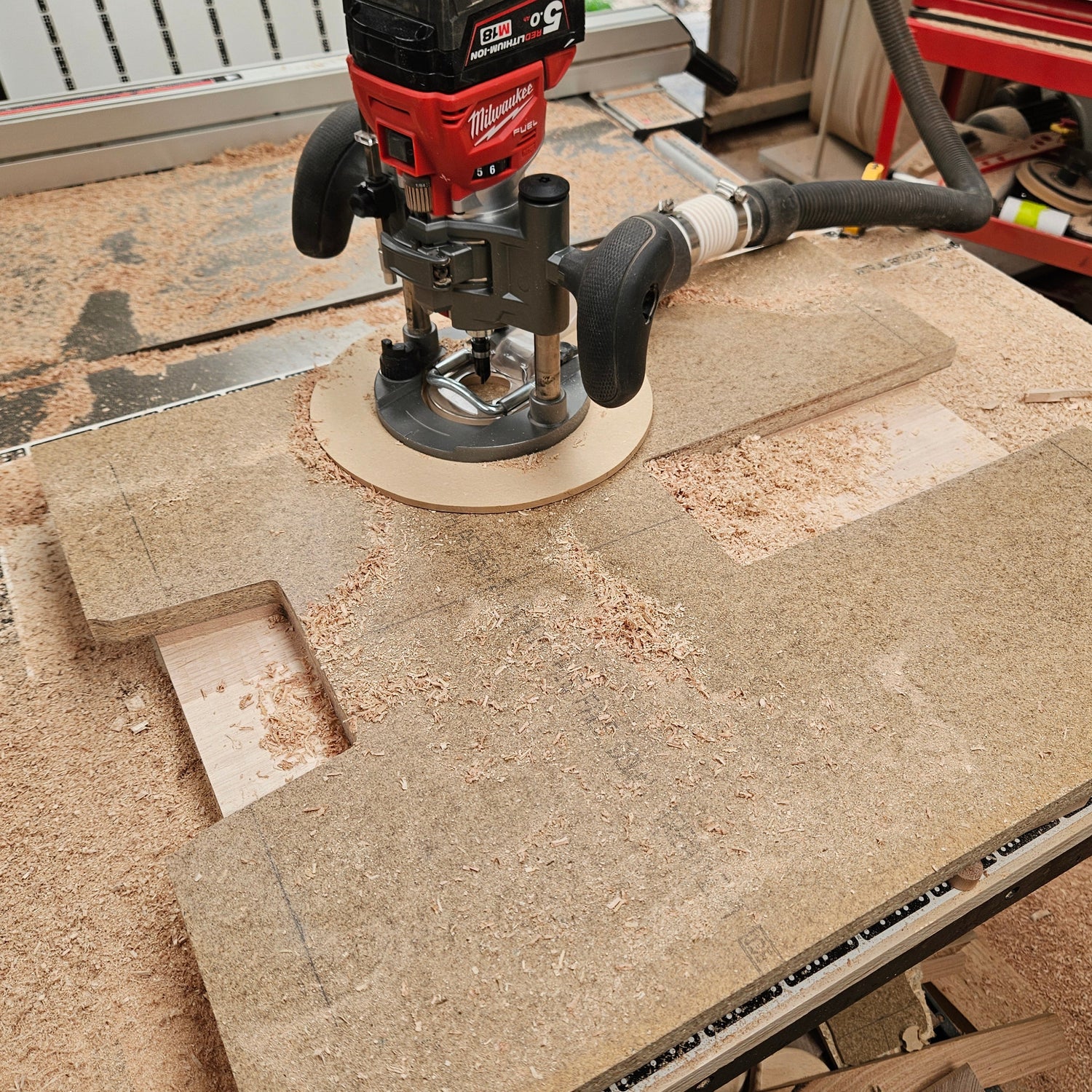 Router on a workbench with a workshop background