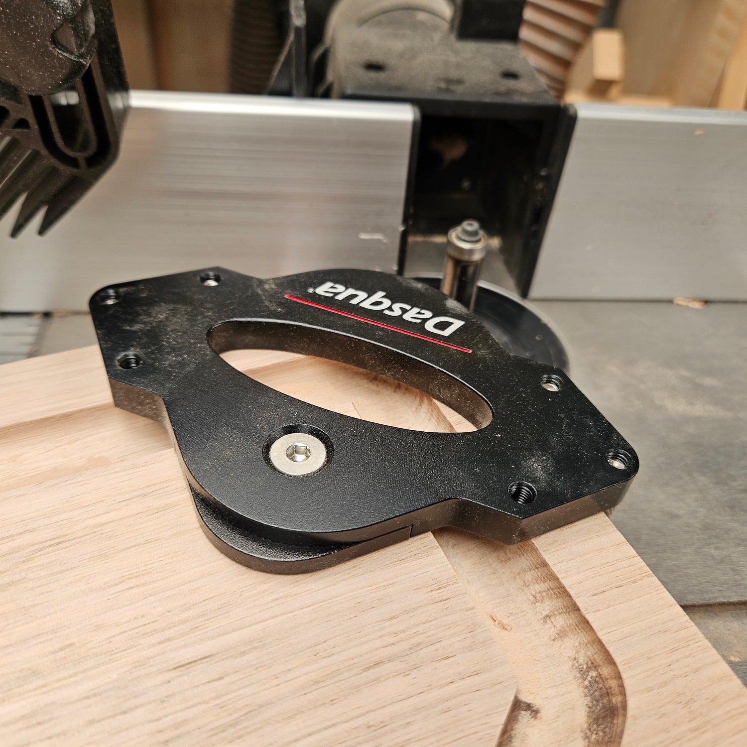 Woodworking tool on a table saw with a wooden plank